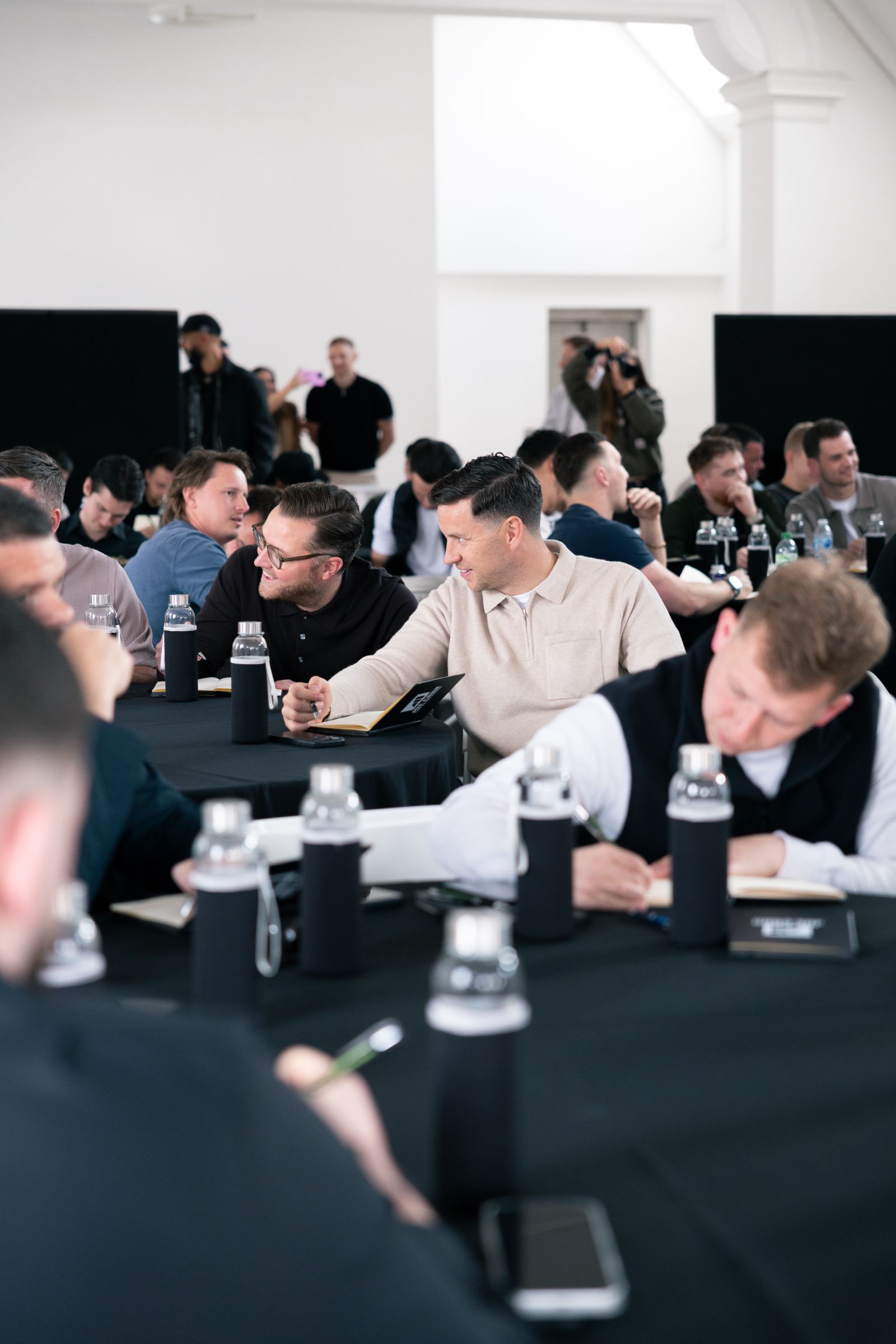 Owners talking at their tables during the JCCA seminar